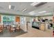 Interior view of the restaurant shows comfortable seating and a well-equipped kitchen area with pizza oven at 11918 Nautica Dr, Orlando, FL 32827