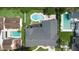 Captivating aerial shot of a house with a backyard oasis, including a pool, a patio, and lush landscaping at 1245 Munster St, Orlando, FL 32803