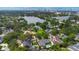 Beautiful aerial shot of neighborhood homes, a lake, and a city skyline, set against a blue sky at 1245 Munster St, Orlando, FL 32803