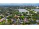 Beautiful aerial shot of neighborhood homes, a lake, and a city skyline, set against a blue sky at 1245 Munster St, Orlando, FL 32803