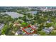 Desirable neighborhood aerial view showcasing a home with a private pool near a scenic lake at 1245 Munster St, Orlando, FL 32803