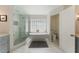 Elegant bathroom featuring a freestanding tub, walk-in shower, and sleek design creating a luxurious retreat at 1245 Munster St, Orlando, FL 32803