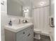 Charming bathroom with a gray vanity, updated fixtures, and a clean, well-lit space for everyday comfort at 1245 Munster St, Orlando, FL 32803