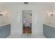 Ensuite bathroom with dual vanities, modern lighting, and a view of the adjoining bedroom creating a relaxing suite at 1245 Munster St, Orlando, FL 32803