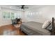 Inviting bedroom featuring plantation shutters, hardwood floors, and a comfortable space with great natural light at 1245 Munster St, Orlando, FL 32803