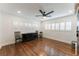 Well-lit bedroom features hardwood floors and large windows with white shutters at 1245 Munster St, Orlando, FL 32803