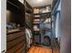 Spacious walk-in closet featuring custom built-ins, shelving, and ample storage for clothes and personal items at 1245 Munster St, Orlando, FL 32803