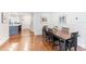 Open-concept dining room with hardwood floors, seamlessly connected to the kitchen, creating an inviting space at 1245 Munster St, Orlando, FL 32803