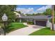 Beautiful home featuring a brick driveway, lush landscaping, and a well-maintained exterior, offering stunning curb appeal at 1245 Munster St, Orlando, FL 32803