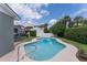Inviting pool area with lush landscaping and a spacious deck for relaxing and entertaining at 1245 Munster St, Orlando, FL 32803