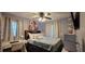 Cozy bedroom featuring a ceiling fan, natural light, and desk at 1302 Center St, Ocoee, FL 34761