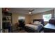 Bedroom featuring a ceiling fan, natural light, and a work desk at 1302 Center St, Ocoee, FL 34761