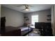 Bedroom featuring a ceiling fan, natural light, and desk at 1302 Center St, Ocoee, FL 34761