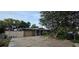 Charming single-story home with a covered entry, large tree, and driveway at 1302 Center St, Ocoee, FL 34761