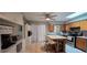 Bright eat-in kitchen with island, stainless appliances, and ample cabinet space at 1302 Center St, Ocoee, FL 34761