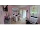 A pink interior studio space with windows, a makeup station and a black lounge chair at 1302 Center St, Ocoee, FL 34761