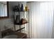 Bathroom with granite countertop, standing shelves, and bright natural light at 1364 Gainesville Dr, Deltona, FL 32725