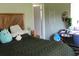 Cozy bedroom featuring a decorative wooden bed and desk area at 1364 Gainesville Dr, Deltona, FL 32725