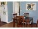 Cozy dining area with a wooden table, four chairs, and rustic décor at 1364 Gainesville Dr, Deltona, FL 32725