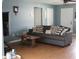 Cozy living room with comfortable seating, neutral decor, and laminate flooring at 1364 Gainesville Dr, Deltona, FL 32725