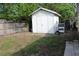 Image of a outdoor white shed in a backyard with a wood fence at 1364 Gainesville Dr, Deltona, FL 32725