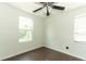 Bedroom featuring laminate flooring, a ceiling fan, and natural light from the window at 1405 Paula Dr, Apopka, FL 32703