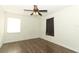 Bedroom featuring modern wood-look flooring, natural light, and ceiling fan at 1405 Paula Dr, Apopka, FL 32703