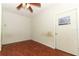 Bedroom with a ceiling fan and light fixture over wood look laminate flooring at 1405 Paula Dr, Apopka, FL 32703