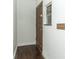 Close-up of front door and entryway with wood-look floors and painted walls at 1405 Paula Dr, Apopka, FL 32703