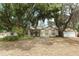 Charming single-story home with mature trees, offering ample shade and curb appeal at 1405 Paula Dr, Apopka, FL 32703