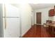 View of the kitchen and dining area with an entryway to a bedroom at 1405 Paula Dr, Apopka, FL 32703