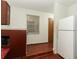 View of the kitchen and dining area with an entryway to a bedroom at 1405 Paula Dr, Apopka, FL 32703