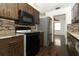 Close-up view of the kitchen with sleek appliances and granite countertops at 1405 Paula Dr, Apopka, FL 32703