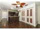 Open-concept living room and kitchen with dark wood flooring and lots of natural light at 1405 Paula Dr, Apopka, FL 32703