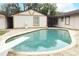 Backyard pool with diving board, complemented by stone deck for outdoor living at 1405 Paula Dr, Apopka, FL 32703