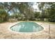 Private backyard pool surrounded by stone pavers, ideal for outdoor enjoyment at 1405 Paula Dr, Apopka, FL 32703