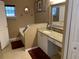 Bathroom with a vanity and sink with granite countertops, and decorative mirrors at 1585 Stefan Cole Ln, Apopka, FL 32703