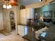 A kitchen featuring granite countertops and white cabinets offering a functional and aesthetically pleasing cooking space at 1585 Stefan Cole Ln, Apopka, FL 32703