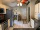 Bright kitchen featuring stainless steel appliances, granite countertops, tiled floors, and plenty of natural light at 1585 Stefan Cole Ln, Apopka, FL 32703