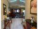 Inviting living room featuring tile floors, skylights, and comfortable seating at 1585 Stefan Cole Ln, Apopka, FL 32703