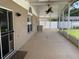 Spacious screened patio with ceiling fan and access to the backyard at 1585 Stefan Cole Ln, Apopka, FL 32703