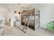 Bedroom features a bunk bed, modern decor, and a bedside table with lamp, perfect for or guests at 1890 Walnut Creek Dr, Kissimmee, FL 34744