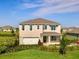 Beautiful two-story home featuring a manicured front yard and an attached two-car garage at 1890 Walnut Creek Dr, Kissimmee, FL 34744