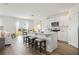 Open-concept kitchen and living area, featuring white cabinets, and a breakfast bar at 1890 Walnut Creek Dr, Kissimmee, FL 34744