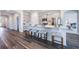 Modern kitchen with stainless steel appliances, a large island, and seating for four at 1974 Walnut Creek Dr, Kissimmee, FL 34744