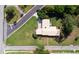 The property's aerial view shows the green lawns and the layout of the home and landscaping at 2001 Lily Ct, Sanford, FL 32771