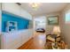 Bright bedroom with storage, and an adjoined seating area that includes a small table at 2001 Lily Ct, Sanford, FL 32771