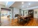 Inviting dining room features hardwood floors, a fireplace, and seamless flow to the living room at 2001 Lily Ct, Sanford, FL 32771