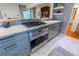 Modern kitchen features stainless steel appliances, gray cabinets, and a stylish backsplash at 2001 Lily Ct, Sanford, FL 32771