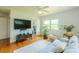 Comfortable living room with hardwood floors, natural light, and neutral furniture at 2001 Lily Ct, Sanford, FL 32771